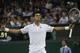 Novak Djokovic of Serbia celebrates defeating Jo-Wilfried Tsonga of France in their men's singles match at the All England Lawn Tennis Championships in Wimbledon, London, Monday, June 30, 2014. (AP Photo/Pavel Golovkin)