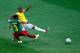 BRASILIA, BRAZIL - JUNE 23: Fernandinho of Brazil scores his team's fourth goal against Nicolas N'Koulou of Cameroon during the 2014 FIFA World Cup Brazil Group A match between Cameroon and Brazil at Estadio Nacional on June 23, 2014 in Brasilia, Brazil. (Photo by Phil Walter/Getty Images)