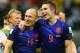 SALVADOR, BRAZIL - JUNE 13: Arjen Robben (L) and Robin van Persie of the Netherlands walk off the field after scoring two goals each and defeating Spain 5-1 during the 2014 FIFA World Cup Brazil Group B match between Spain and Netherlands at Arena Fonte Nova on June 13, 2014 in Salvador, Brazil. (Photo by Quinn Rooney/Getty Images)