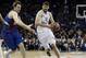 Real Madrid's Nikola Mirotic, right, dribbles past Barcelona Regal's Erazem Lorbek, left, during a Euroleague Final-Four semi-final basketball game at the O2 Arena, in London, Friday, May 10, 2013. (AP Photo/Lefteris Pitarakis)