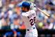 NEW YORK, NY - JUNE 15: Daniel Murphy #28 of the New York Mets follows through on a second inning run scoring sacrifice fly against the San Diego Padres at Citi Field on June 15, 2014 in the Flushing neighborhood of the Queens borough of New York City. (Photo by Jim McIsaac/Getty Images)