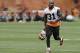 Cleveland Browns defensive back Donte Whitner runs off the field after a mandatory minicamp practice at the NFL football team's facility in Berea, Ohio Thursday, June 12, 2014. (AP Photo/Mark Duncan)