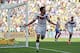 Germany's Mats Hummels celebrates after scoring his side's first goal during the World Cup quarterfinal soccer match between Germany and France at the Maracana Stadium in Rio de Janeiro, Brazil, Friday, July 4, 2014. (AP Photo/Matthias Schrader)