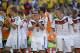 Germany's Philipp Lahm, center, smiles at the end of the World Cup quarterfinal soccer match between Germany and France at the Maracana Stadium in Rio de Janeiro, Brazil, Friday, July 4, 2014. Germany won the match 1-0. . (AP Photo/David Vincent)