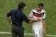 Germany's head coach Joachim Loew, left, talks to Miroslav Klose after he substituted him during the World Cup quarterfinal soccer match between Germany and France at the Maracana Stadium in Rio de Janeiro, Brazil, Friday, July 4, 2014. (AP Photo/Thanassis Stavrakis)
