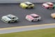 Jul 3, 2014; Daytona Beach, FL, USA; NASCAR Sprint Cup Series driver Kyle Busch (18) leads a pack of cars through turn four during practice for the Coke Zero 400 at Daytona International Speedway. Mandatory Credit: Rob Foldy-USA TODAY Sports