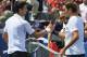 Novak Djokovic, left, from Serbia, congratulates Roger Federer, from Switzerland, after the men's final at the Western & Southern Open tennis tournament on Sunday, Aug. 19, 2012, in Mason, Ohio. Federer won 6-0, 7-6 (7). (AP Photo/Al Behrman)