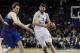 Real Madrid's Nikola Mirotic, right, dribbles past Barcelona Regal's Erazem Lorbek, left, during a Euroleague Final-Four semi-final basketball game at the O2 Arena, in London, Friday, May 10, 2013. (AP Photo/Lefteris Pitarakis)
