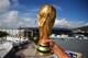 RIO DE JANEIRO, BRAZIL - JUNE 11: A fan holds a replica of the World Cup Trophy near the Maracana Stadium on June 11, 2014 in Rio de Janeiro, Brazil. (Photo by Matthias Hangst/Getty Images)