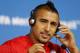 Arturo Vidal of Chile adjusts his headphones during a press conference at the Itaquerao Stadium in Sao Paulo, Brazil, Sunday, June 22, 2014. Chile will play Netherlands in a match that will decide the winner of Group B at the 2014 soccer World Cup. (AP Photo/Wong Maye-E)