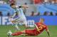 Argentina's Lionel Messi skips over the challenge of Belgium's Toby Alderweireld during the World Cup quarterfinal soccer match between Argentina and Belgium at the Estadio Nacional in Brasilia, Brazil, Saturday, July 5, 2014. (AP Photo/Martin Meissner)