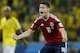 Colombia's James Rodriguez celebrates scoring his side's first goal on a penalty kick during the World Cup quarterfinal soccer match between Brazil and Colombia at the Arena Castelao in Fortaleza, Brazil, Friday, July 4, 2014. (AP Photo/Natacha Pisarenko)