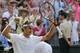 Roger Federer of Switzerland turns towards his family, friends and coaches as he celebrates defeating Milos Raonic of Canada in their men’s singles semifinal match at the All England Lawn Tennis Championships at Wimbledon, London, Friday, July, 4, 2014. (AP Photo/Ben Curtis)