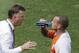 Netherlands' head coach Louis van Gaal, left, instructs Wesley Sneijder during a cooling break of the World Cup round of 16 soccer match between the Netherlands and Mexico at the Arena Castelao in Fortaleza, Brazil, Sunday, June 29, 2014. (AP Photo/Themba Hadebe)