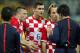 Croatia's Ivan Rakitic, second from right, Dejan Lovren (6) and Ivica Olic complain to referee Yuichi Nishimura, right, from Japan, after Nishimura issued a penalty against Croatia during the group A World Cup soccer match between Brazil and Croatia in the opening game of the tournament at Itaquerao Stadium in Sao Paulo, Brazil, Thursday, June 12, 2014. Brazil was given a penalty kick following the call resulting in a goal by Neymar. (AP Photo/Frank Augstein)