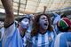 Soccer fans wearing the colors associated with Argentina's national soccer team, celebrate the opening goal scored against Belgium in a World Cup quarterfinals' match at the Estadio Nacional, in Brasilia, Brazil, Saturday, July 5, 2014. Gonzalo Higuain scored his first goal of this World Cup to give Argentina a 1-0 halftime lead over Belgium in their quarterfinal on Saturday. (AP Photo/Rodrigo Abd)
