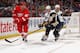 DETROIT - MARCH 13: Johan Franzen #93 of the Detroit Red Wings passes the puck past Tyler Myers #57 of the Buffalo Sabres during an NHL game at Joe Louis Arena on March 13, 2010 in Detroit, Michigan. Detroit defeated Buffalo 3-2 in OT. (Photo by Dave Reginek/NHLI via Getty Images)