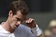 Andy Murray of Britain wipes his brow after playing a point against Grigor Dimitrov of Bulgaria during their men's singles quarterfinal match at the All England Lawn Tennis Championships in Wimbledon, London, Wednesday July 2, 2014. (AP Photo/Toby Melville, Pool)