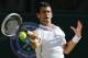 Novak Djokovic of Serbia plays a return to Roger Federer of Switzerland during their men's singles final at the All England Lawn Tennis Championships in Wimbledon, London, Sunday, July 6, 2014. (AP Photo/Ben Curtis)