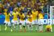 BELO HORIZONTE, BRAZIL - JUNE 28: (L-R) Thiago Silva, Luiz Gustavo, Ramires, Dani Alves, Jo, Marcelo, Hulk, Willian and Neymar of Brazil celebrate after defeating Chile in a penalty shootout during the 2014 FIFA World Cup Brazil round of 16 match between Brazil and Chile at Estadio Mineirao on June 28, 2014 in Belo Horizonte, Brazil. (Photo by Quinn Rooney/Getty Images)