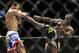 Uriah Hall kicks Thiago Santos during their middleweight mixed martial arts bout at UFC 175 on Saturday, July 5, 2014, in Las Vegas. (AP Photo/John Locher)