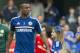 Chelsea's Ashley Cole, walks around the pitch with his children at the end of their English Premier League soccer match against Norwich City, at the Stamford Bridge Stadium in London, Sunday, May 4, 2014. (AP Photo/Bogdan Maran)