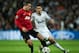 MADRID, SPAIN - FEBRUARY 13: Robin van Persie (L) of Manchester United duels for the ball with Angel Di Maria of Real Madrid during the UEFA Champions League Round of 16 first leg match between Real Madrid and Manchester United at Estadio Santiago Bernabeu on February 13, 2013 in Madrid, Spain. (Photo by Jasper Juinen/Getty Images)