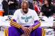 PORTLAND, OR - APRIL 10: Kobe Bryant #24 of the Los Angeles Lakers, wearing an NBA Green Week T-shirt, sits on the bench before playing against the Portland Trail Blazers on April 10, 2013 at the Rose Garden Arena in Portland, Oregon. NOTE TO USER: User expressly acknowledges and agrees that, by downloading and or using this photograph, user is consenting to the terms and conditions of the Getty Images License Agreement. Mandatory Copyright Notice: Copyright 2013 NBAE (Photo by Sam Forencich/NBAE via Getty Images)