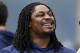 Seattle Seahawks' Marshawn Lynch stands on the field at an NFL football minicamp practice Wednesday, June 18, 2014, in Renton, Wash. (AP Photo/Elaine Thompson)