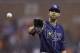 Tampa Bay Rays starting pitcher David Price waits on the throw from catcher Jose Molina during the ninth inning of a baseball game against the Detroit Tigers in Detroit, Sunday, July 6, 2014. (AP Photo/Carlos Osorio)