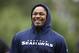 Seattle Seahawks' Marshawn Lynch walks off the field following a football minicamp practice that he watched from the sidelines Tuesday, June 17, 2014, in Renton, Wash. (AP Photo/Elaine Thompson)