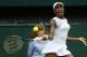 Venus Williams of U.S. returns to Petra Kvitova of the Czech Republic during their women's singles match at the All England Lawn Tennis Championships in Wimbledon, London, Friday, June 27, 2014. (AP Photo/Sang Tan)