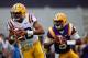 LSU quarterbacks Anthony Jennings (left) and Brandon Harris (right) warm up before the spring game.