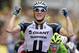 Germany's sprinter Marcel Kittel crosses the finish line ahead of celebrates on the podiums, bottom right, to win the third stage of the Tour de France cycling race over 155 kilometers (96.3 miles) with start in Cambridge and finish in London, England, Monday, July 7, 2014. (AP Photo/Peter Dejong)