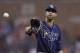 Tampa Bay Rays starting pitcher David Price waits on the throw from catcher Jose Molina during the ninth inning of a baseball game against the Detroit Tigers in Detroit, Sunday, July 6, 2014. (AP Photo/Carlos Osorio)