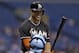 Miami Marlins' Giancarlo Stanton smiles as he talk to Tampa Bay Rays catcher Jose Molina prior to batting during the first inning of an interleague baseball game Wednesday, June 4, 2014, in St. Petersburg, Fla. (AP Photo/Chris O'Meara)