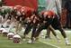 Nebraska quarterback Tommy Armstrong Jr. (4) performs stretches in front of other quarterbacks on the first day of spring NCAA college football practice in Lincoln, Neb., Saturday, March 8, 2014. (AP Photo/Nati Harnik)