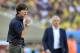 Germany's head coach Joachim Loew, left, and France's head coach Didier Deschamps stand on the touchline during the World Cup quarterfinal soccer match between Germany and France at the Maracana Stadium in Rio de Janeiro, Brazil, Friday, July 4, 2014. (AP Photo/Martin Meissner)