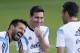 Argentina's Lionel Messi, center, laughs with teammates Ezequiel Lavezzi, left, and Martin Demichelis, right, during a training session in Vespesiano, near Belo Horizonte, Brazil, Sunday, July 6, 2014. Argentina will face Netherlands on their semifinal match of the 2014 World Cup soccer tournament on July 9 in Sao Paulo.(AP Photo/Victor R. Caivano)
