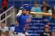 Daniel Murphy following through on his swing