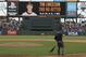 A groundskeeper sweeps the field after San Francisco Giants starting pitcher Tim Lincecum threw a no-hitter in their baseball game against the San Diego Padres Wednesday, June 25, 2014, in San Francisco. Lincecum threw his second career no-hitter. San Francisco won the game 4-0. (AP Photo/Eric Risberg)