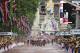 The pack with Stage winner Marcel Kittel of Germany sprints down The Mall as Buckingham Palace is seen in the rear during the third stage of the Tour de France cycling race over 155 kilometers (96.3 miles) with start in Cambridge and finish in London, England, Monday, July 7, 2014. (AP Photo/Peter Dejong)