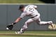 Chicago White Sox second baseman Gordon Beckham runs down a sharp grounder from Minnesota Twins' Brian Dozier, who singled, in the seventh inning of a baseball game, Saturday, June 21, 2014, in Minneapolis. The Twins won 4-3. (AP Photo/Jim Mone)
