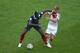 RIO DE JANEIRO, BRAZIL - JULY 04: Paul Pogba of France fights off Toni Kroos of Germany during the 2014 FIFA World Cup Brazil Quarter Final match between France and Germany at Maracana on July 4, 2014 in Rio de Janeiro, Brazil. (Photo by Clive Rose/Getty Images)