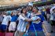 Argentina soccer fans celebrate their team's World Cup quarterfinal victory over Belgium at the Estadio Nacional, in Brasilia, Brazil Saturday, July 5, 2014. Gonzalo Higuain's first goal of this World Cup sent Argentina into the semifinals on Saturday with a 1-0 win over Belgium. (AP Photo/Rodrigo Abd)
