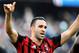 AC Milan's Adil Rami, left, and teammate Michael Essien celebrate at the end of a Serie A soccer match between Sampdoria and AC Milan, at the Luigi Ferraris stadium in Genoa, Italy, Sunday, Feb. 23, 2014. AC Milan won 2-0. (AP Photo/Carlo Baroncini)