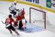 Los Angeles Kings center Jeff Carter (77) scores a goal against Chicago Blackhawks goalie Corey Crawford (50) as the Blackhawks defenseman Johnny Oduya (27) watches during the first period in Game 7 of the Western Conference finals in the NHL hockey Stanley Cup playoffs Sunday, June 1, 2014, in Chicago. (AP Photo/Charles Rex Arbogast)