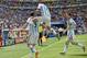 Argentina's Gonzalo Higuain, left, celebrates with Angel di Maria, center, and Lionel Messi after he scored the opening goal during the World Cup quarterfinal soccer match between Argentina and Belgium at the Estadio Nacional in Brasilia, Brazil, Saturday, July 5, 2014. (AP Photo/Martin Meissner)