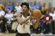 Orlando Magic's Elfrid Payton looks to pass the ball against the Houston Rockets during an NBA summer league basketball game in Orlando, Fla., Monday, July 7, 2014. (AP Photo/John Raoux)