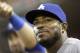 Los Angeles Dodgers' Yasiel Puig watches from the dugout during a baseball game against the Cincinnati Reds, Monday, June 9, 2014, in Cincinnati. (AP Photo/Al Behrman)